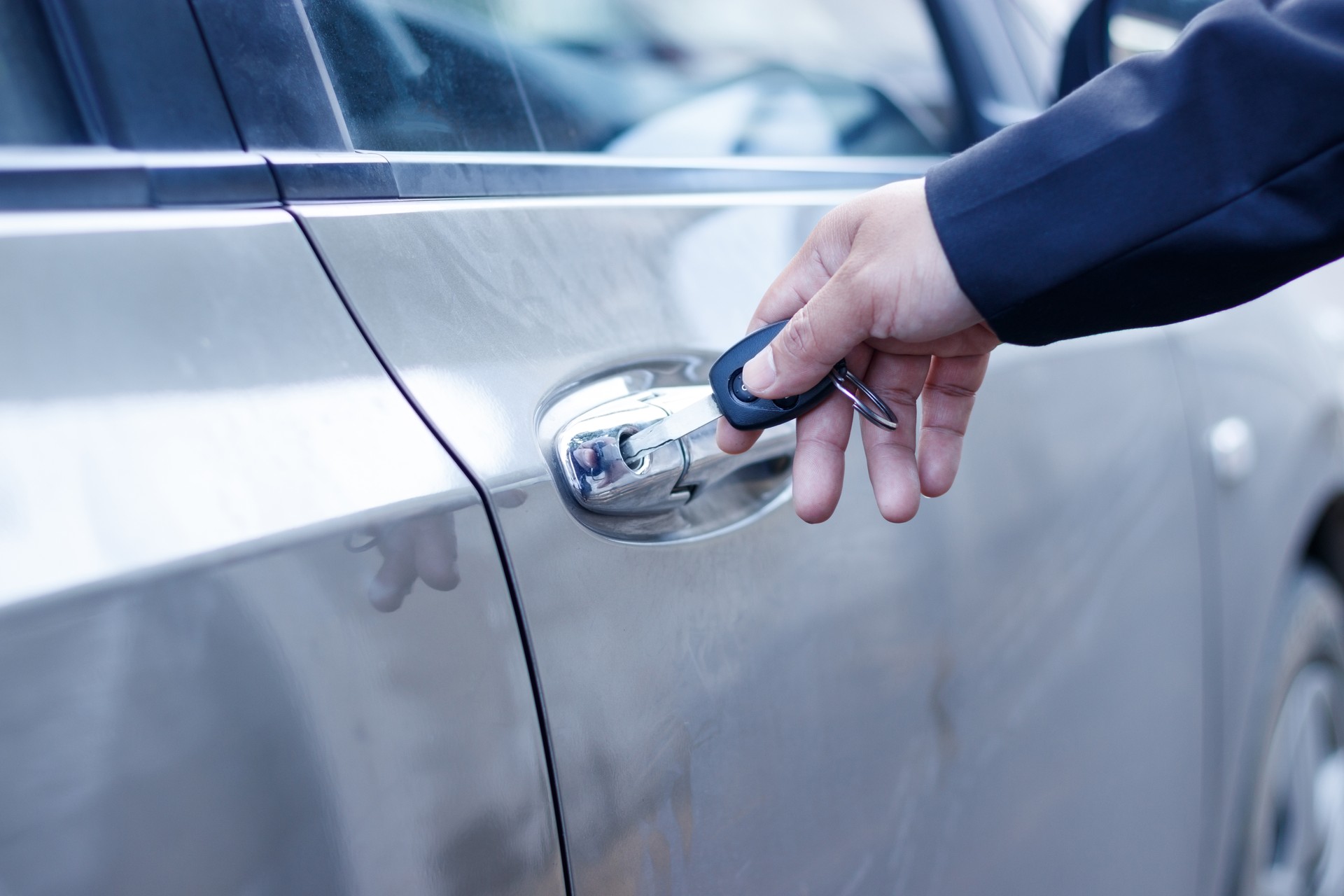 Businessman with car key.